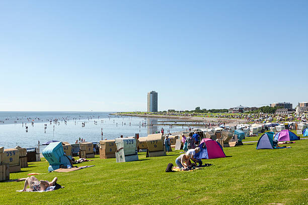 Buesum, Germany - July 20, 2016: People enjoying a hot summer day at the crowded beach area of Buesum.