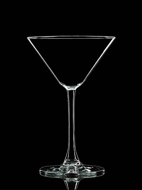 istock Silhouette of white martini glass on black 613901256