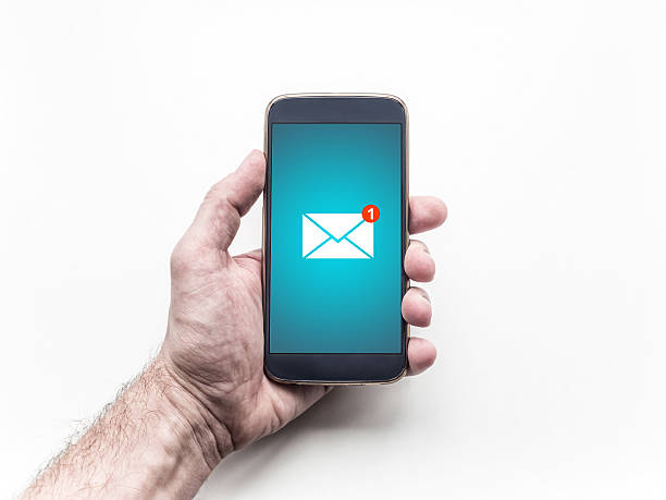 istock Hand holding mobile smart phone with message on a screen. 613902408