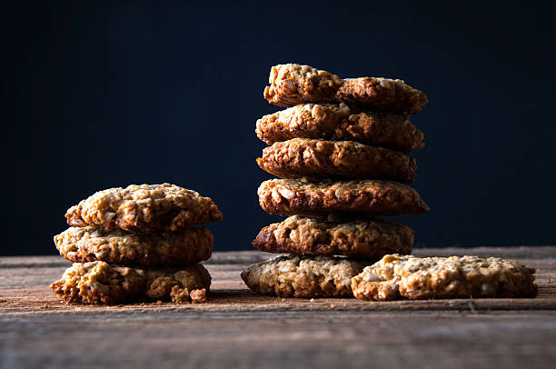 istock Stacked cookies on dark background 613904062