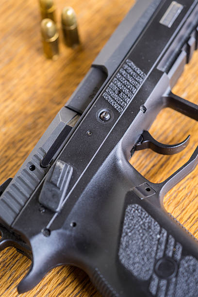 istock Close up view of bullets and handgun. 613904596