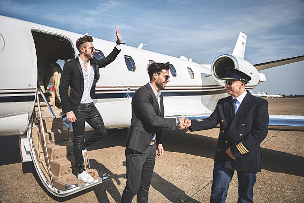 istock Passangers leaving private jet airplane 613905178