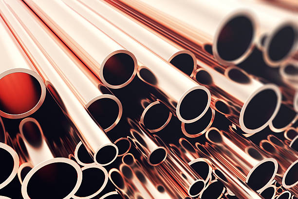 Heap of shiny copper pipes with selective focus effect. 3d stock photo