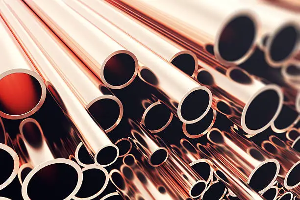Heap of shiny copper pipes with selective focus effect. 3d rendering.