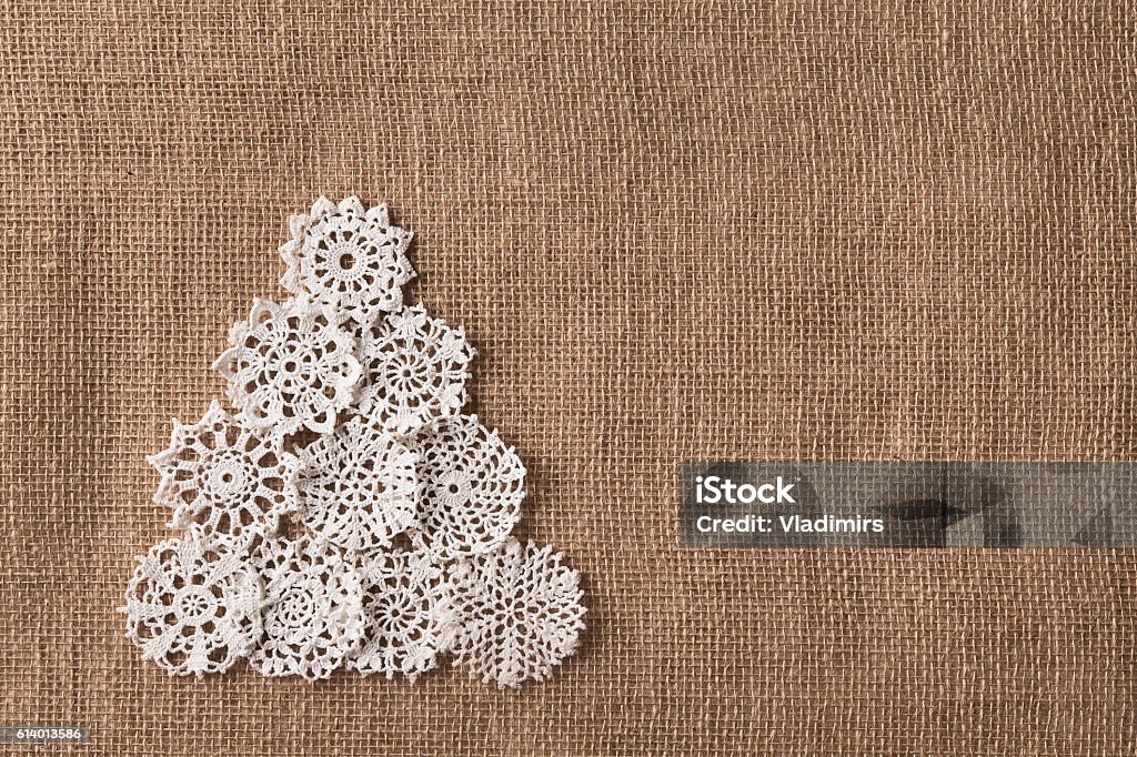 Abstract Christmas Tree, Lace Embroid Snowflake, Burlap Snow Flake Abstract Christmas Tree, Lace Embroid Snowflake On Burlap Background, Snow Flake Decoration Crochet Stock Photo