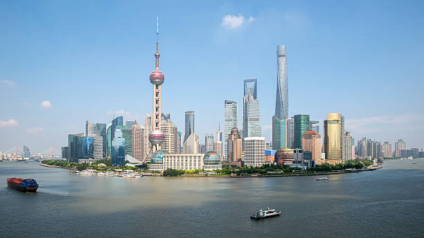 istock shanghai skyline against a blue sky 614013892