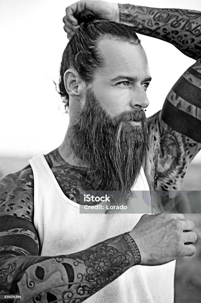 Handsome Bearded Tattooed Man Posing For Portrait Stock Photo - Download  Image Now - Men, Tattoo, Males - iStock
