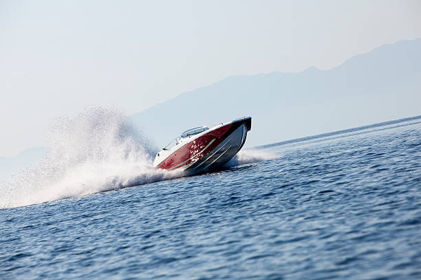 luxury speedboat luxury speedboat speeding across the sea racing boat photos stock pictures, royalty-free photos & images