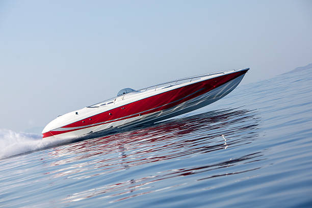 luxury speedboat luxury speedboat speeding across the sea fast boat stock pictures, royalty-free photos & images