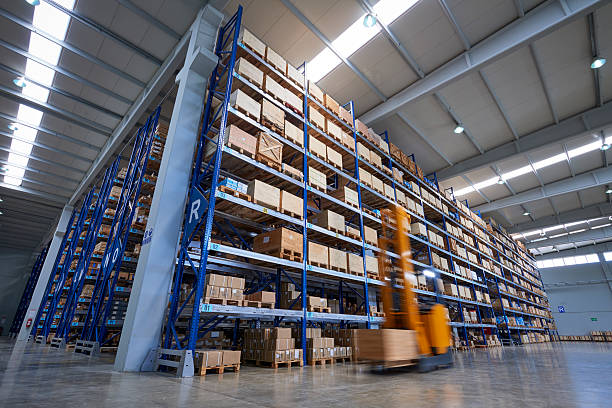 istock Forklift carrying cardboard box in warehouse. 614020042