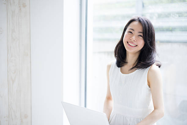 Woman using a laptop stock photo