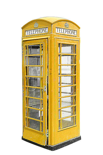 istock Classic British yellow phone booth in London UK, isolated 614022014