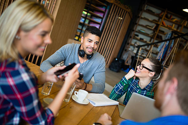 istock Young business people cooperating and brainstorming during coffee break. 614023680