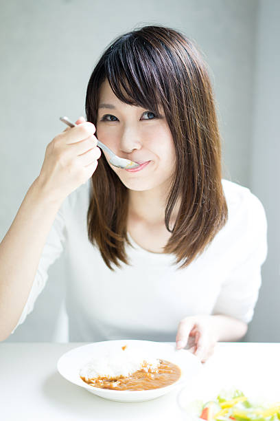 istock Woman eating a meal 614025088