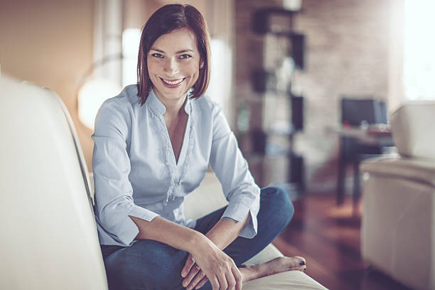 istock Beautiful young woman at home 614025430