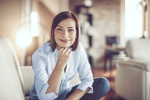 istock Beautiful young woman at home 614025486
