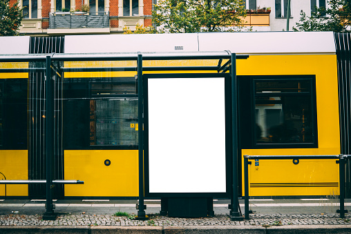 A blank billboard at a tram station