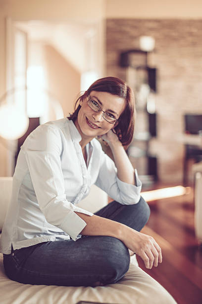 istock Beautiful young woman at home 614025880