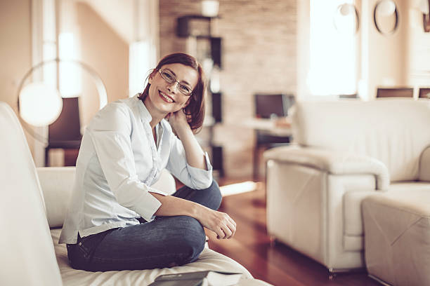 istock Beautiful young woman at home 614025954