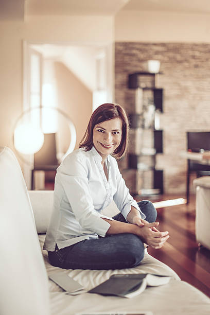 istock Beautiful young woman at home 614026068