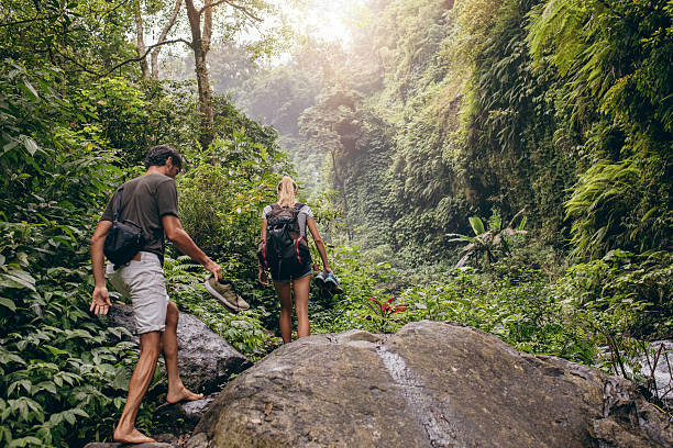 istock Couple hiking on mountain trail 614026418