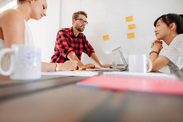 istock Discussion during business meeting in conference room 614026888