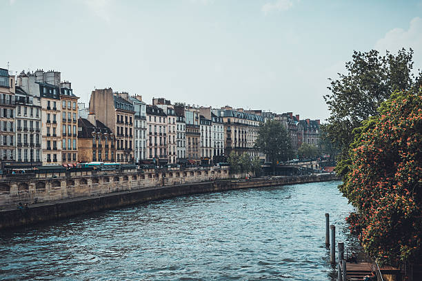 istock Empty urban canal with row of apartments beside it 614027134