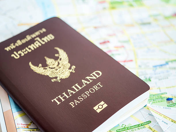 istock Thailand passport on paper map 1 614027872