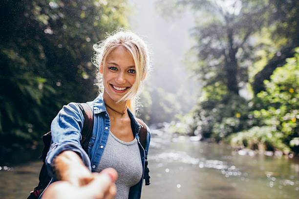 istock Young couple on nature hike 614028128