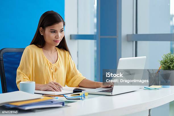Working On Computer Stock Photo - Download Image Now - Filipino Ethnicity, Laptop, Occupation