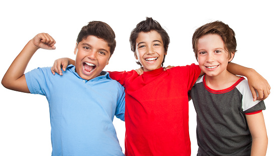 Portrait of a three happy boys isolated on white background, best friends posing in the studio, happy teen lifestyle