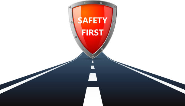 Safety first sign on road File format is EPS10.0.  safety first stock illustrations