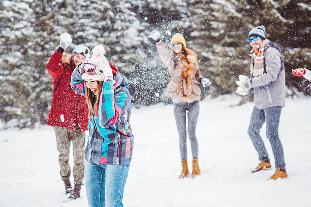 istock Snowball fight with friends 614028948