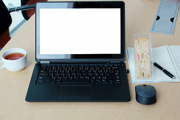 istock Laptop with blank screen on desk in Conference room. 614032242