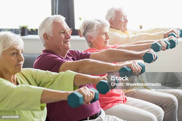 Seniors Using Weights Stock Photo - Download Image Now - Senior Adult, Relaxation Exercise, Exercising