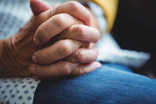 istock close-up of joined hands 614035486