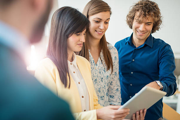 istock Business people using digital tablet in company 614035828