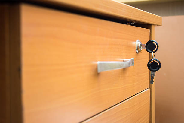 istock Drawer with keys in the lock 614036134