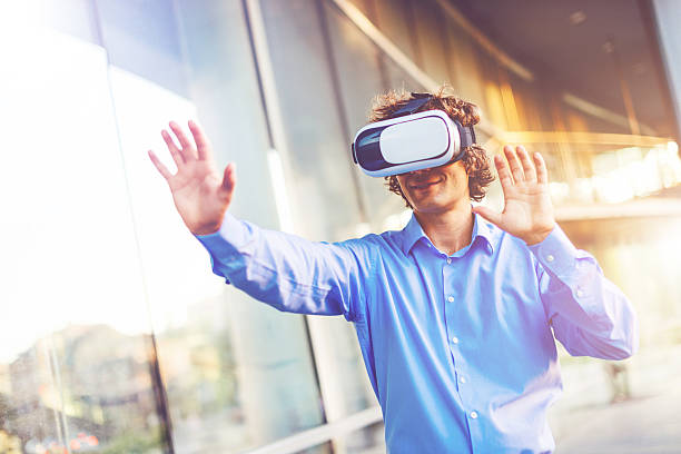 istock Businessman wearing VR glasses and enjoys fun 614036528