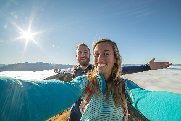istock Young couple capturing achievement moment with selfie 614036816