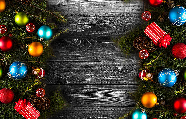 istock Merry Christmas Frame with real wood and colorful baubles 614036894