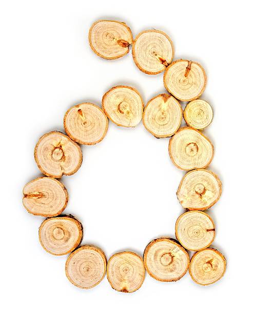 istock Alphabet letters made from Wood slice on white Background.a. 614037082