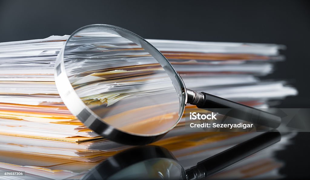 Documents Search File Stack and Magnifying Glass Magnifying Glass Stock Photo