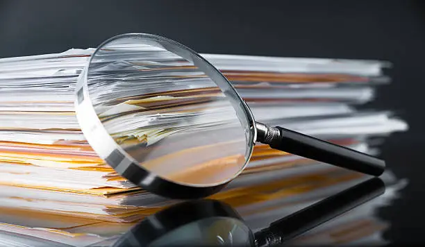 File Stack and Magnifying Glass