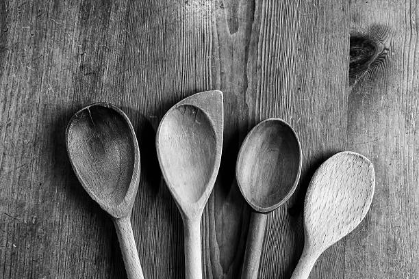 istock Four wooden spoons on the kitchen table 614039716