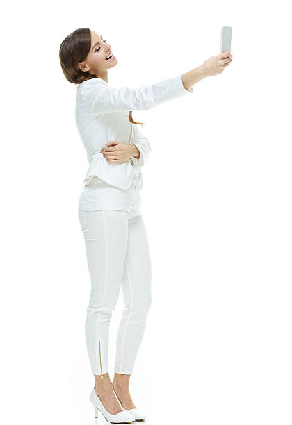 istock Smiling businesswoman taking a selfie 614040432