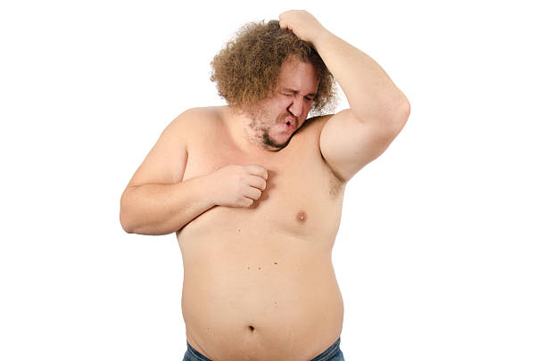 Sweat and bad smell of axilla Stink. Man sniffing  armpit. White background. fat ugly face stock pictures, royalty-free photos & images