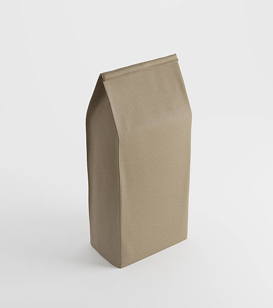 istock Beige lunch paper bag on white surface 614040692