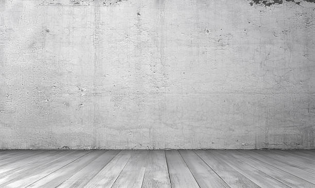 istock Rendering of interior with white concrete wall and wooden floor. 614043370