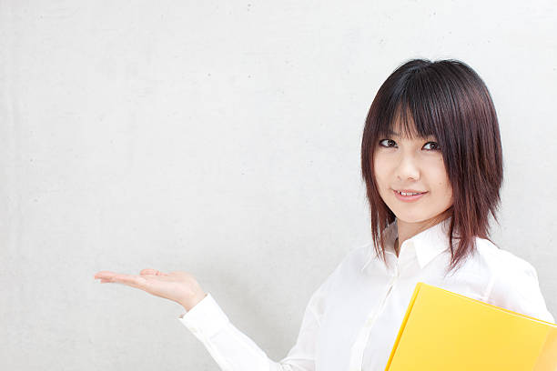 istock Businesswoman holding a folder 614044910